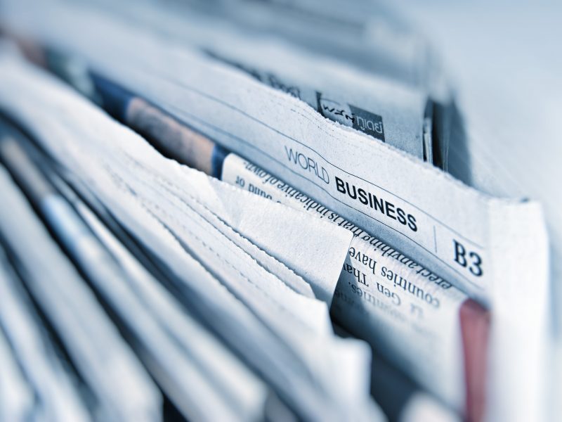 close up in stacked newspapers