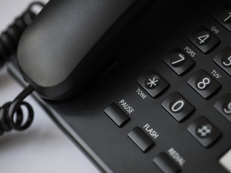 Close up of a black landline telephone