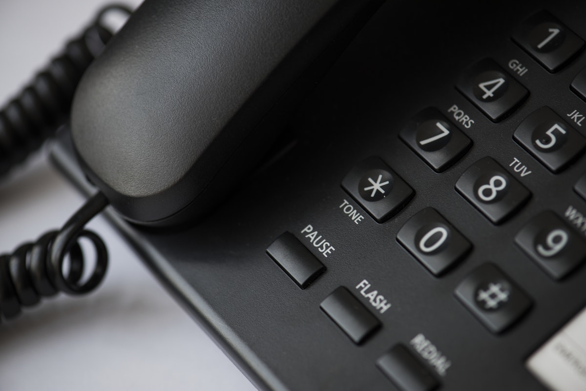 Close up of a black landline telephone